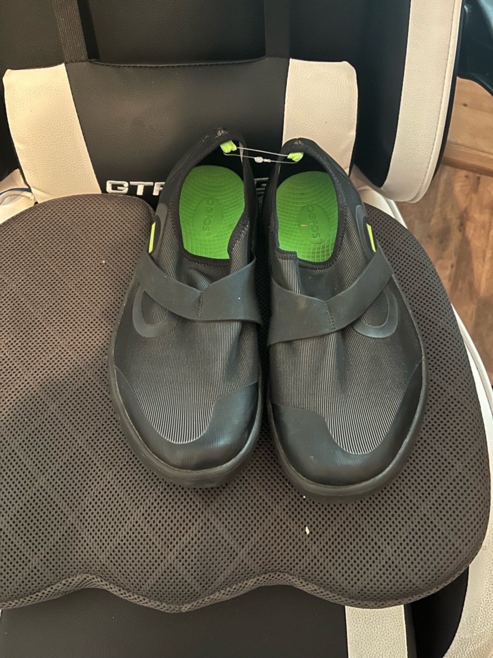 OOFOS Black Slip-On with Green Insole Accent